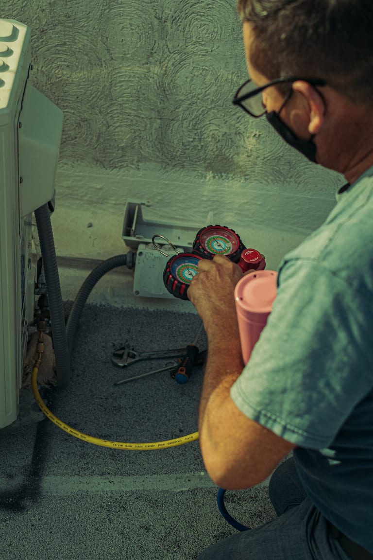 HVAC technician performing a careful system inspection